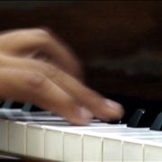 Hand on the Piano Keys