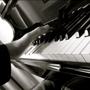 Hands on Grand Piano Keyboard